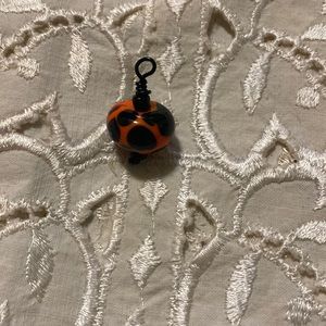 Orange & black blown glass bead pendant